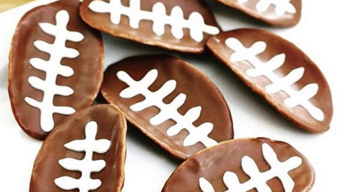 Chips covered in chocolate with white icing, making it look like a Football