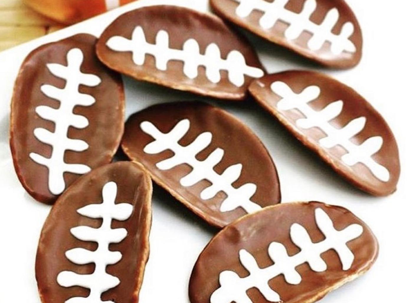 Chips covered in chocolate with white icing, making it look like a Football