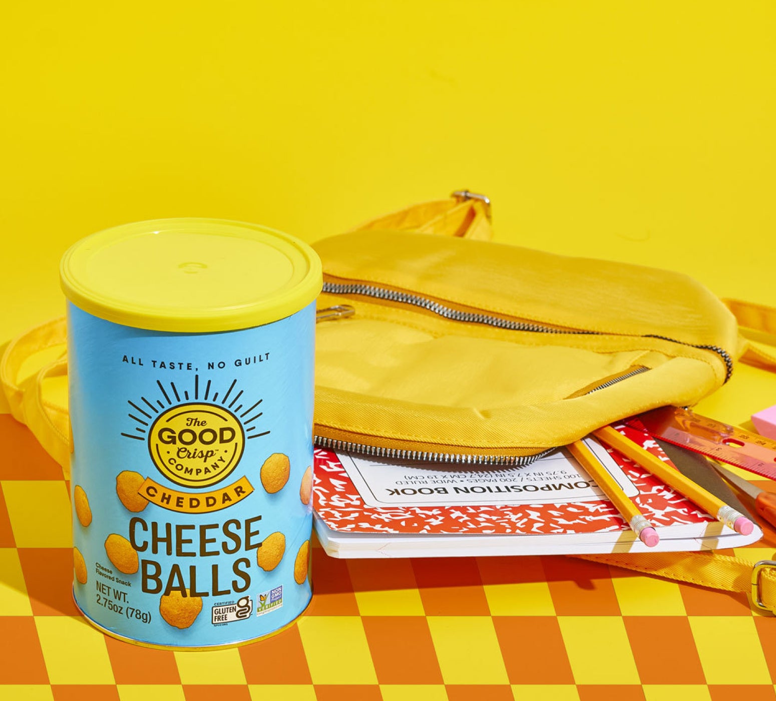 Cheese Balls cannister next to pile of stationary
